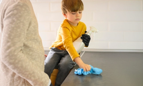 father-and-child-organizing-kitchen-after-meal