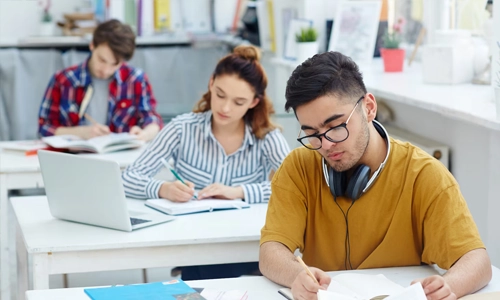 University student studying for a bachelor's degree in a library 
