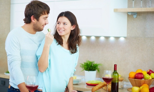 Couple cooking together and enjoying time in the kitchen