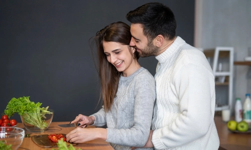 Couple spending time together while preparing a meal
