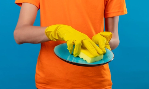 image of a sponge working hard to clean household items