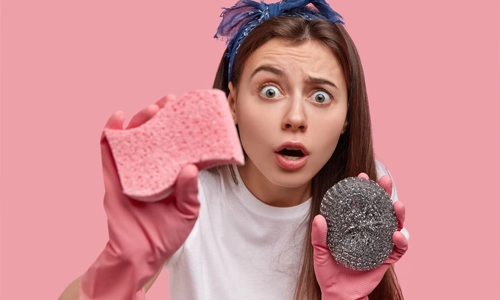 using sponge to clean every nook and corner of your appliance.