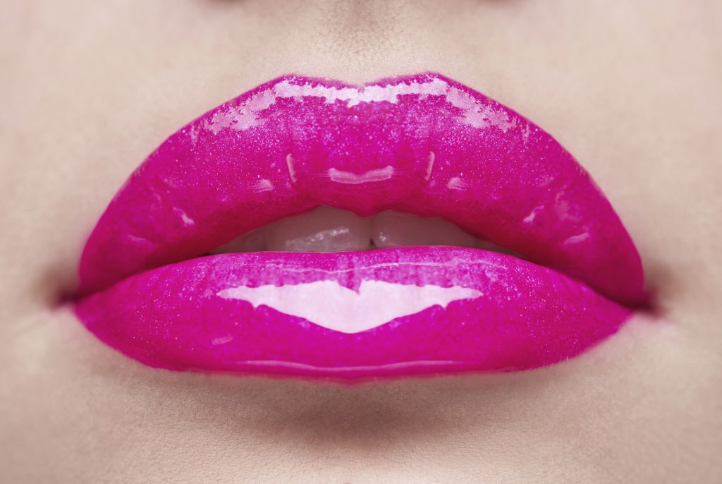 woman's lips with bright makeup