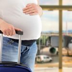 pregnant woman with luggage