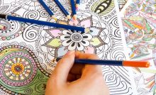 Colouring a mandala design.