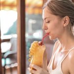 A girl drinking juice