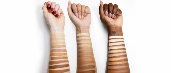Shades of foundation swatched on different skin tones