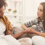 A girl helping her friend who is going through a recent breakup