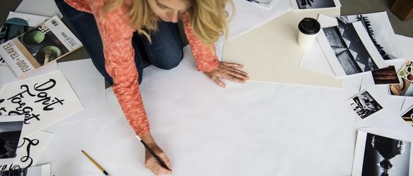 A woman is working in a messy place