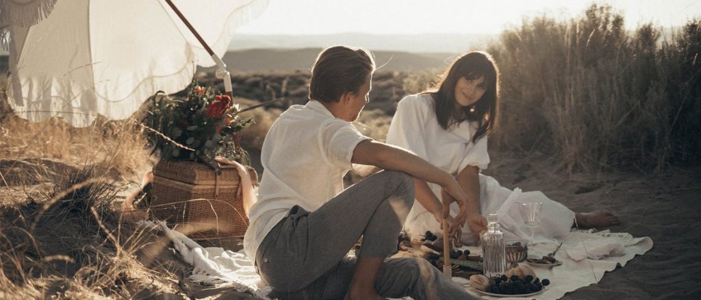a couple talking about their upcoming honeymoon