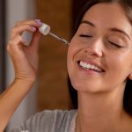 Woman applying a Face Serum