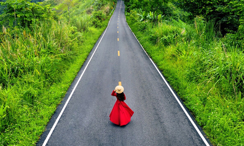 Woman-standing-on-the-road