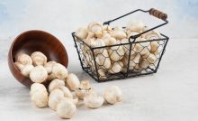 Mushrooms-inside-the-wooden-cup-and-the-metallic-basket