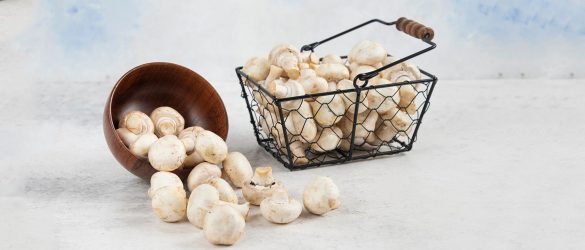 Mushrooms-inside-the-wooden-cup-and-the-metallic-basket