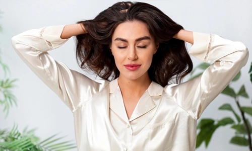 Woman doing herself a scalp massage