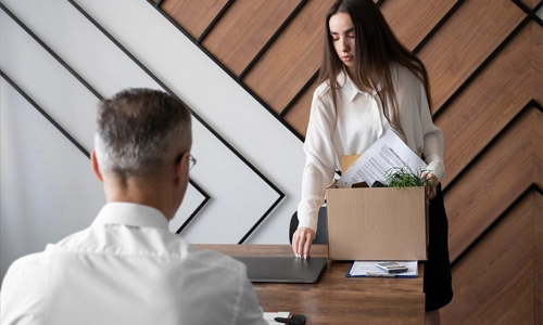 Woman leaving her workplace as she prepares for a career transition