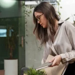 Woman holding a cardboard box for leaving her office