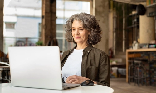 Portrait woman with laptop working